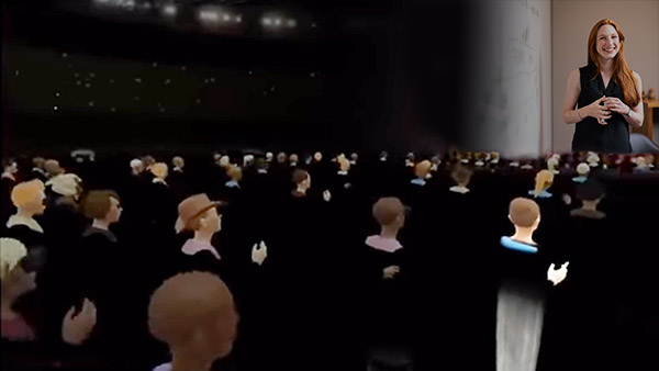 Virtual professor addressing a room full of students in VR